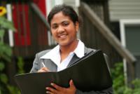 Real Estate Agent with pen and folder